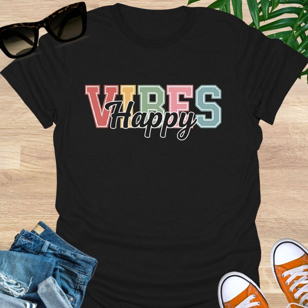 “Happy Vibes” in retro varsity letters with script overlay on a black unisex tee.