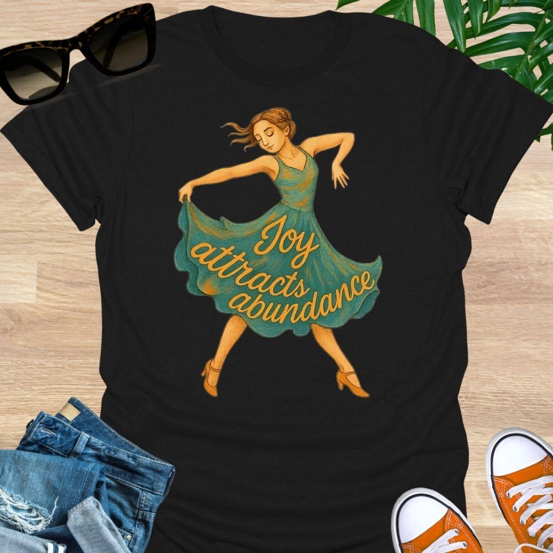 Joy attracts abundance dancer illustration on a black unisex manifesting tee