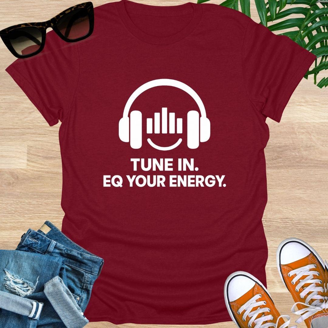 Red t-shirt with headphones graphic and text 'Tune In. EQ Your Energy.