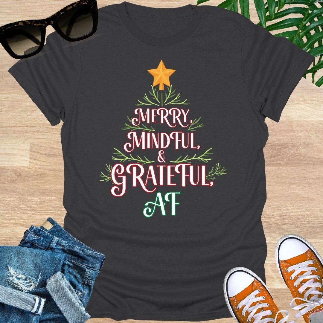 “Merry, Mindful & Grateful, AF” Christmas text forming a tree with greenery and star on a charcoal unisex tee.