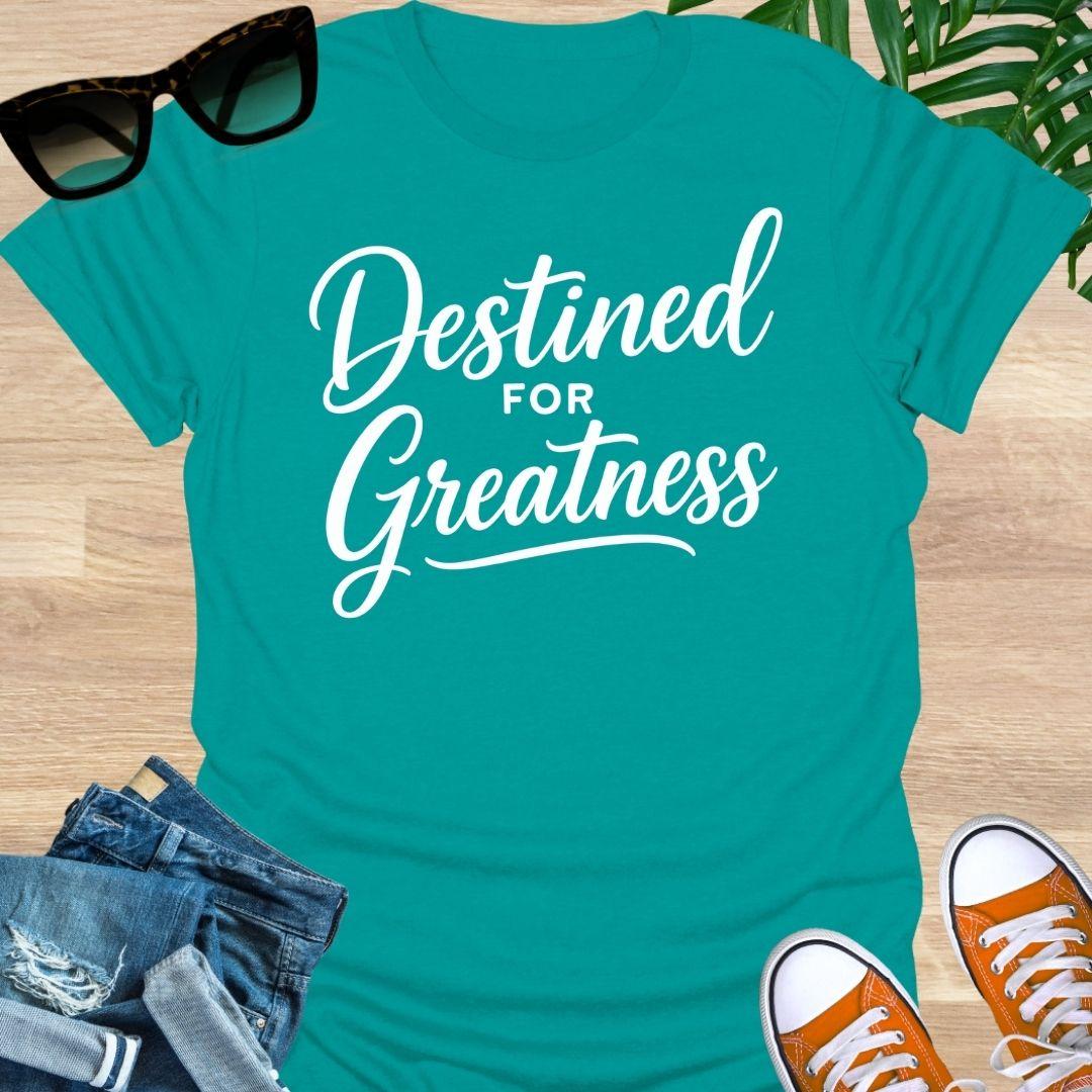 White script text reading “Destined for Greatness” on a jade dome motivational graphic tee.