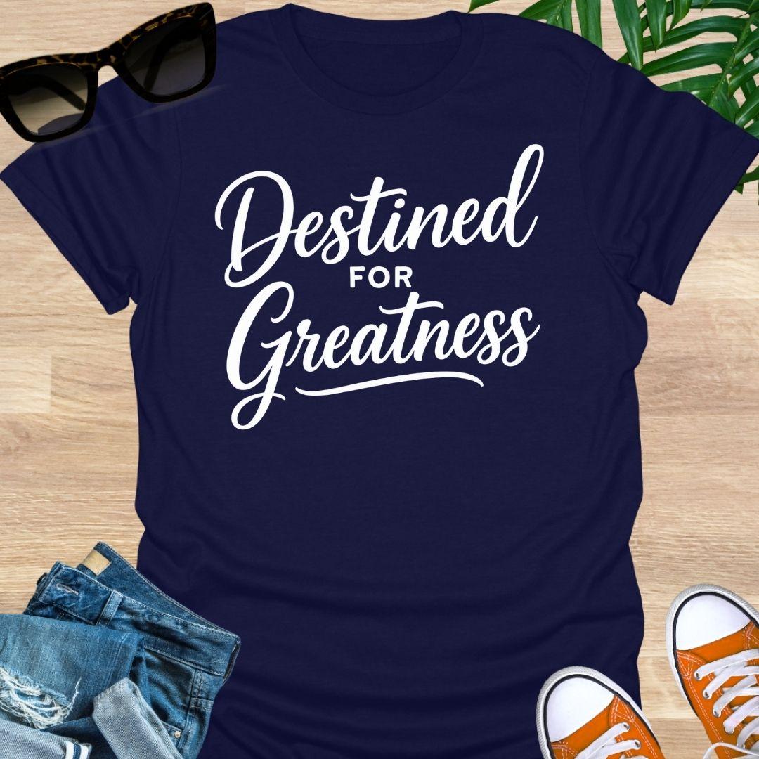 White script text reading “Destined for Greatness” on a navy motivational graphic tee.