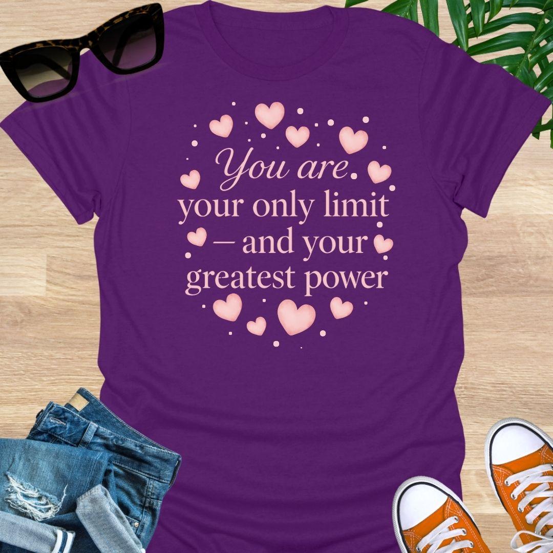 Pink hearts around the quote “You are your only limit—and your greatest power” on a purple unisex tee.