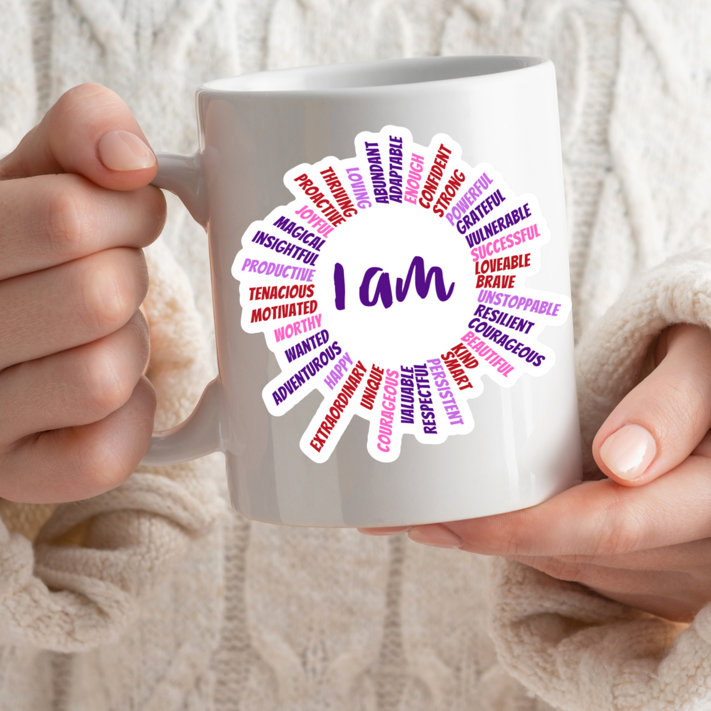 AFFIRMATION, Mantra, Meditation, Motivational, I AM Sun Vinyl Sticker. Has 36 positive words like rays of the sun. The middle says, I AM. Colors are pink, purple, red on a coffee mug
