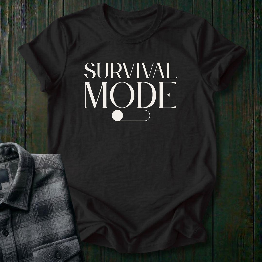 Minimalist typography design featuring the phrase "Survival Mode Off" with a toggle switch graphic in the off position on a black tee. 