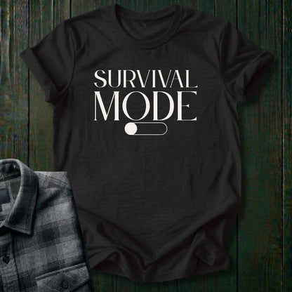Minimalist typography design featuring the phrase "Survival Mode Off" with a toggle switch graphic in the off position on a black tee. 