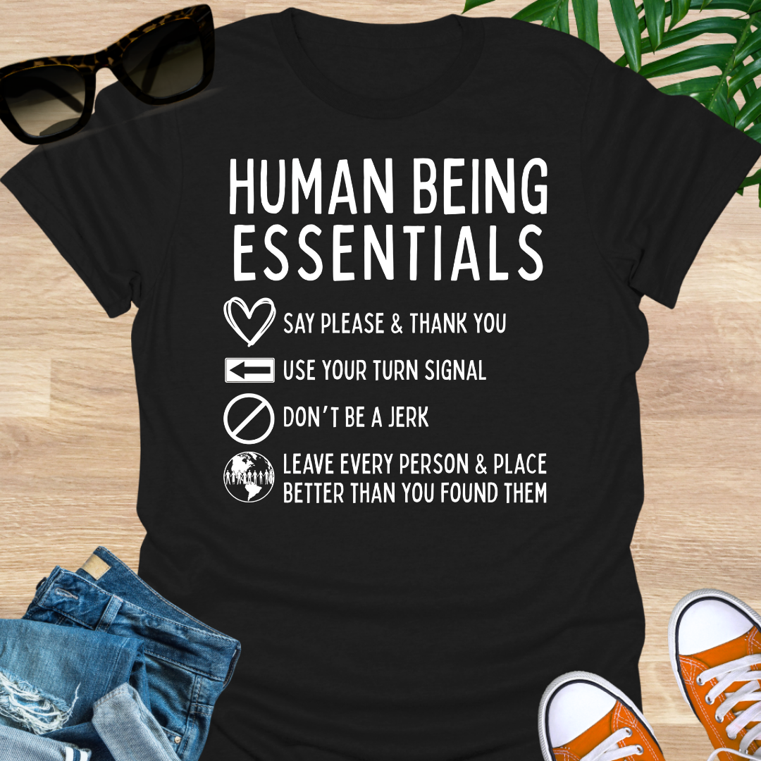 Funny “Human Being Essentials” checklist, please and thank you, turn signal, don’t be a jerk, leave it better, white icons on black unisex tee.