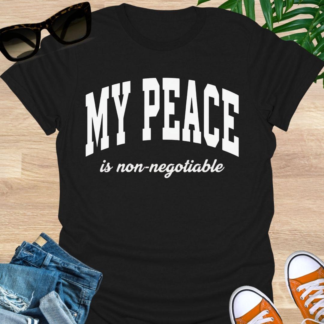 “My Peace Is Non-Negotiable” in white collegiate lettering on a black unisex tee.