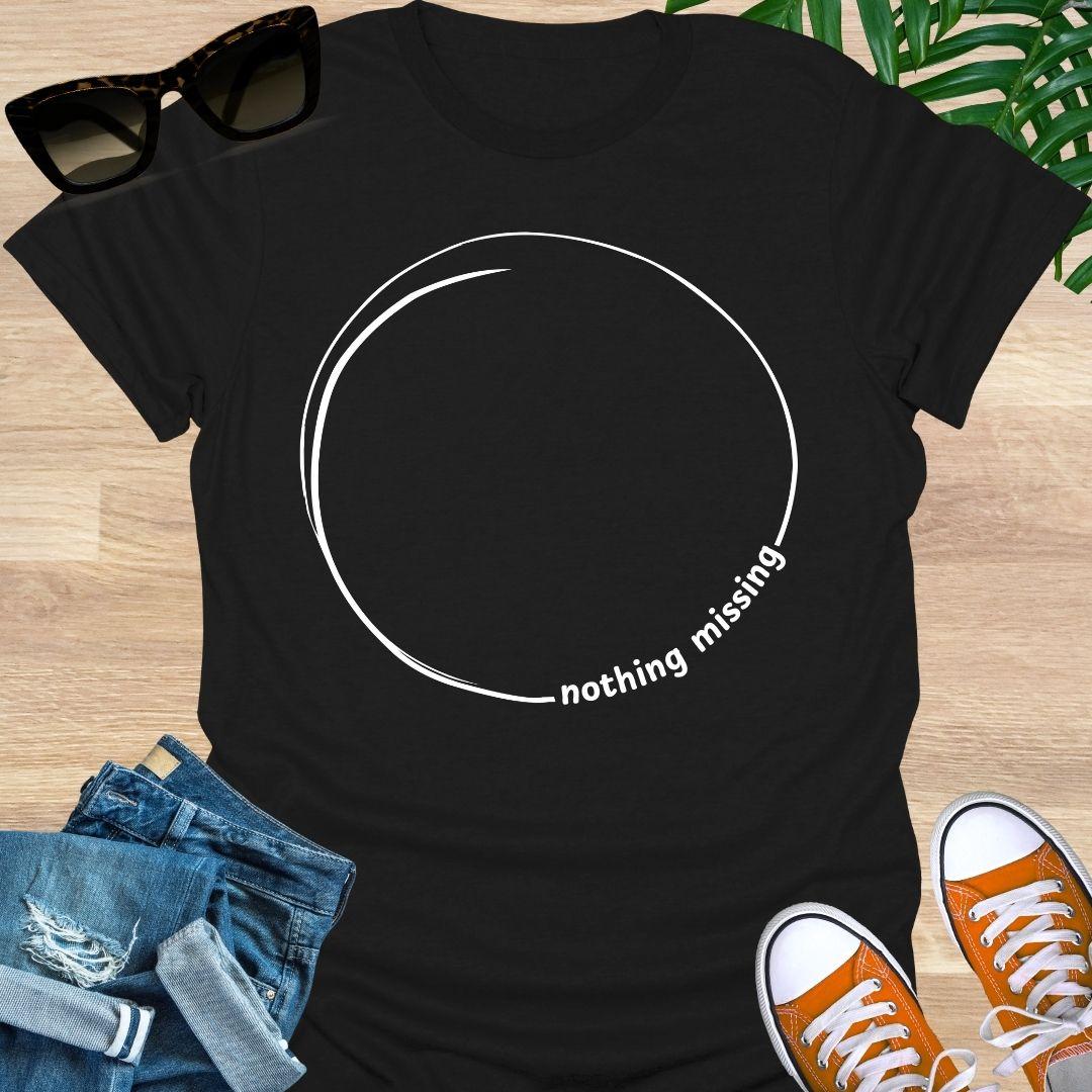 Minimal incomplete circle line art with the words “nothing missing” on a black unisex t-shirt