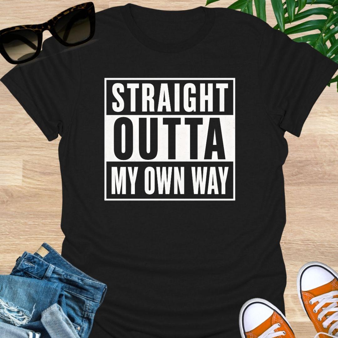 White block text reading “Straight Outta My Own Way” on a black unisex tee