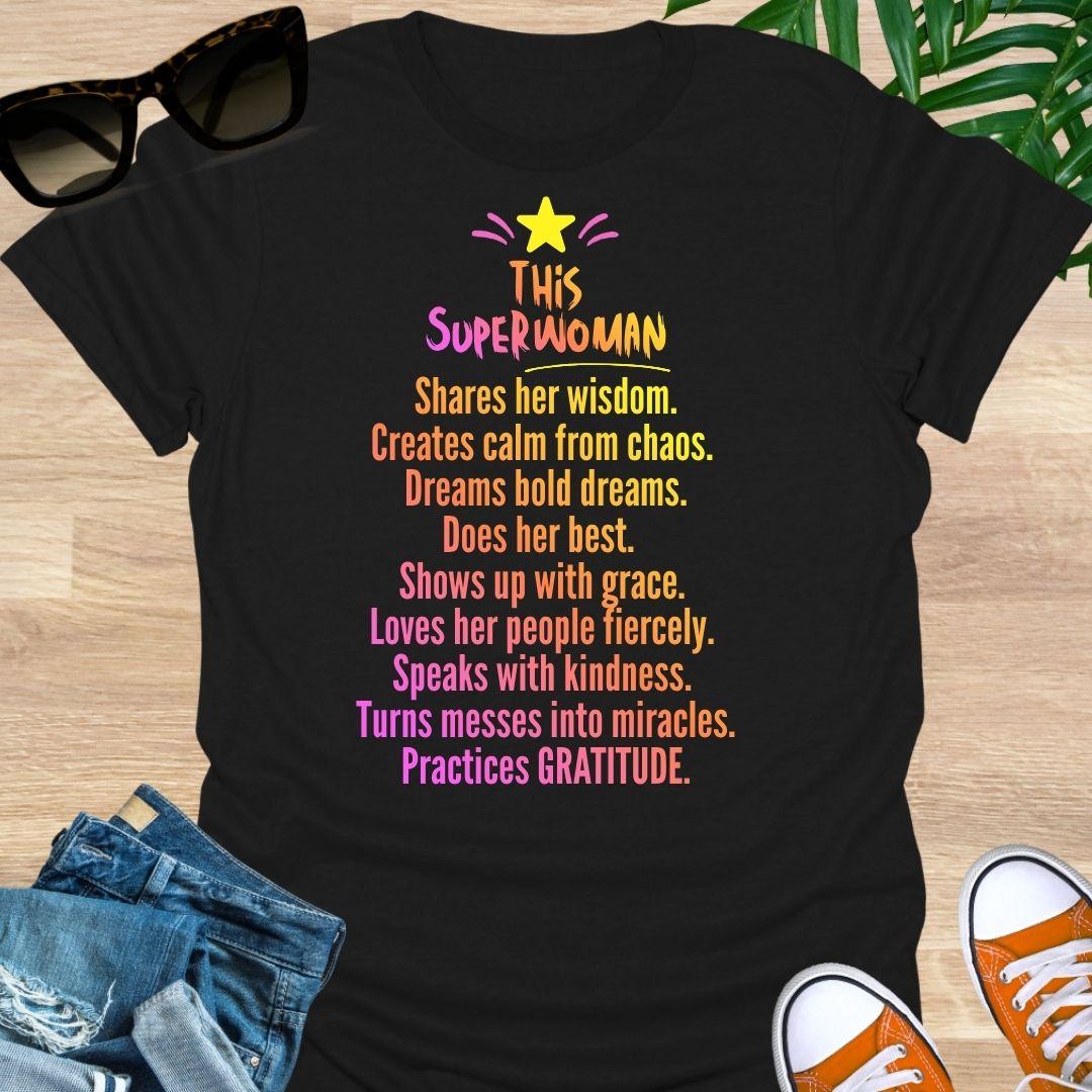 "This Superwoman” rainbow text with star—gratitude quote on a black unisex tee