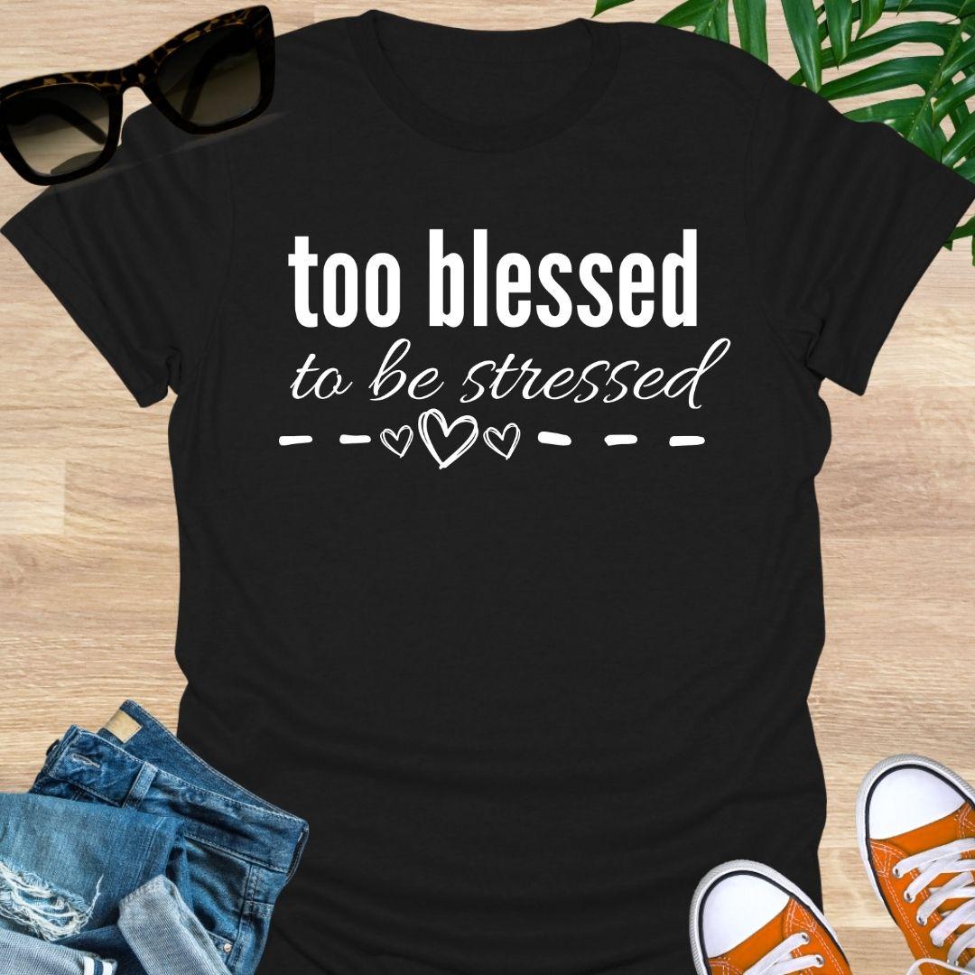 “Too Blessed to Be Stressed” text tee with hand-drawn hearts, white lettering on a black unisex T-shirt.