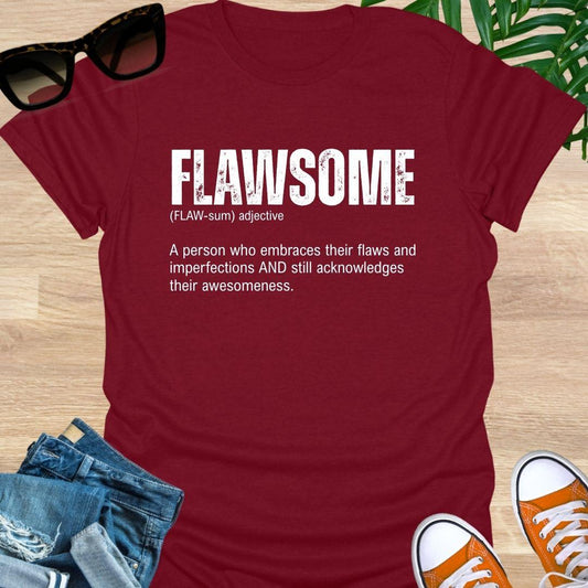 Red unisex t-shirt with  “FLAWSOME” definition in bold white type, embrace flaws and awesomeness