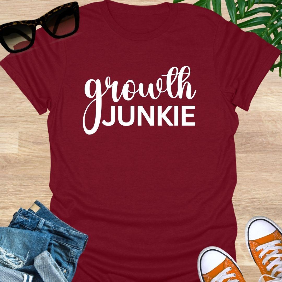 Red t-shirt with Bold “Growth Junkie” in white text 