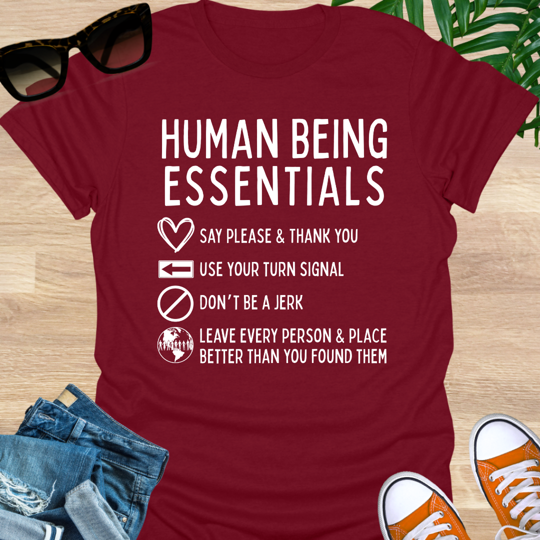 Funny “Human Being Essentials” checklist, please and thank you, turn signal, don’t be a jerk, leave it better, white icons on red unisex tee.