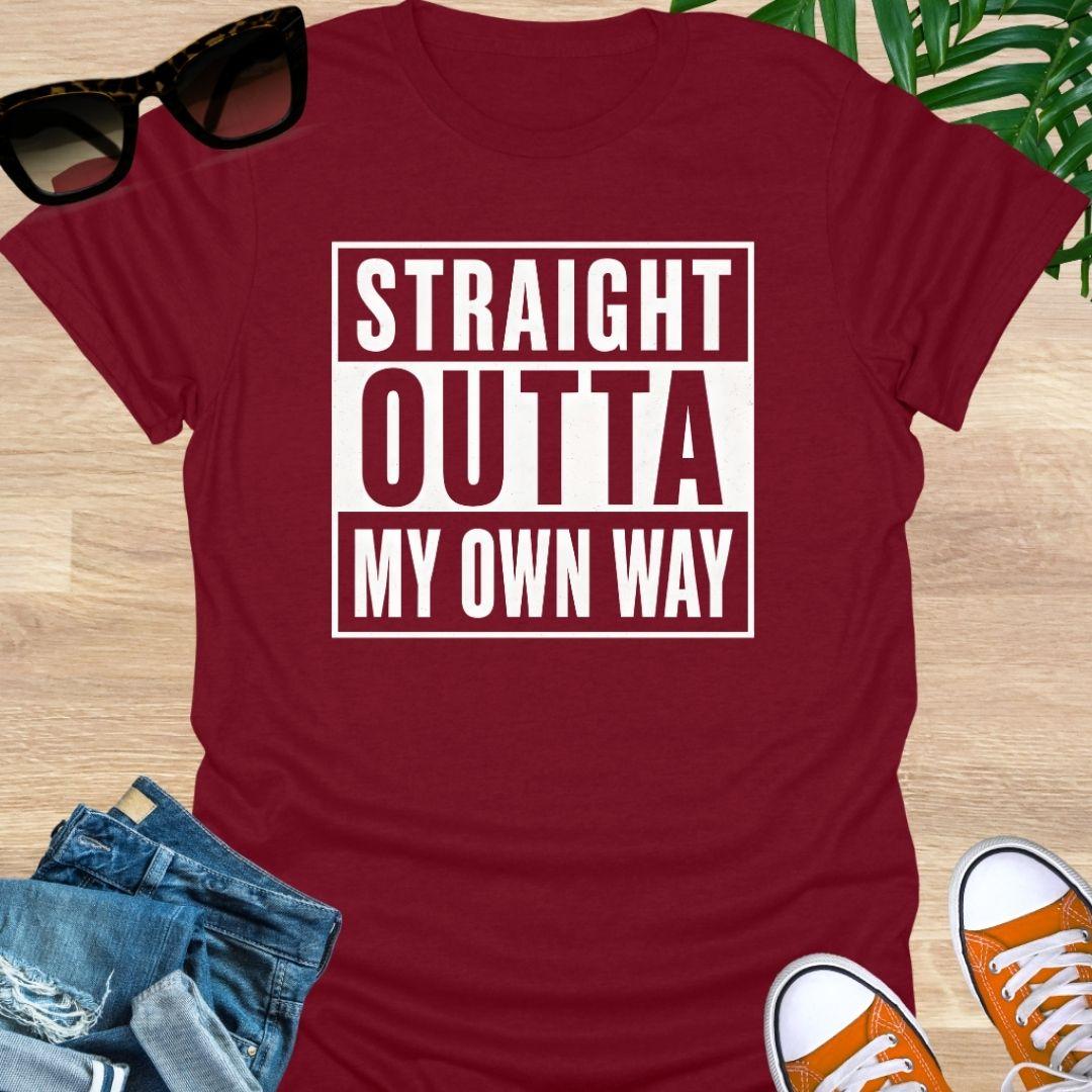 White block text reading “Straight Outta My Own Way” on a red unisex tee