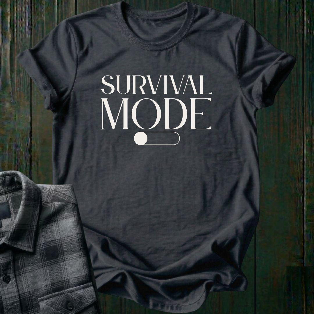 Minimalist typography design featuring the phrase "Survival Mode Off" with a toggle switch graphic in the off position on a charcoal gray tee. 