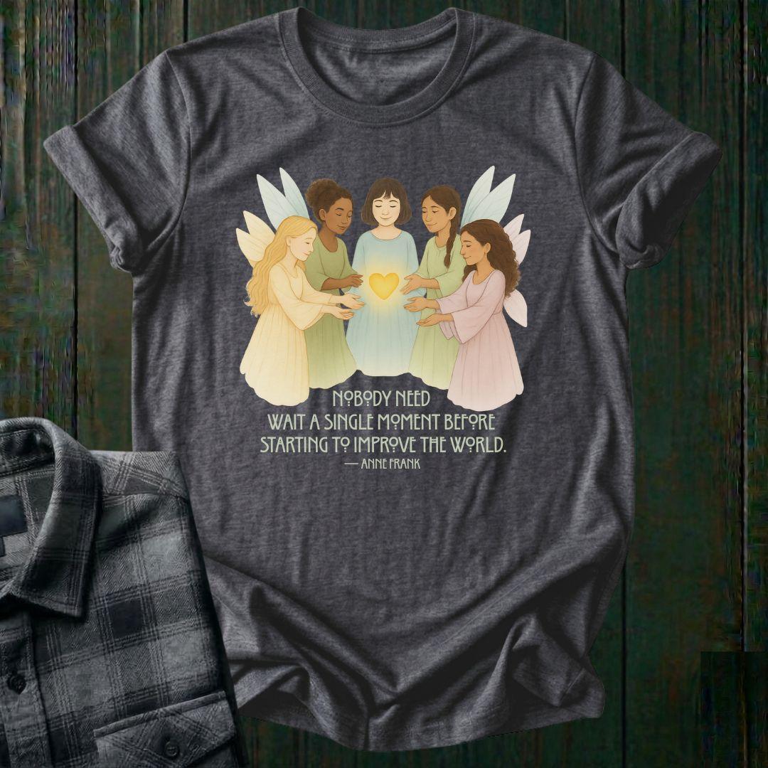 Gray t-shirt with fairy graphic and quote on a wooden surface