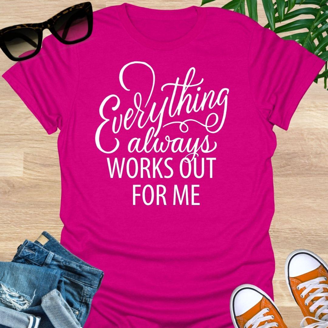 White script text reads “Everything always works out for me” on a hot pink unisex affirmation tee.