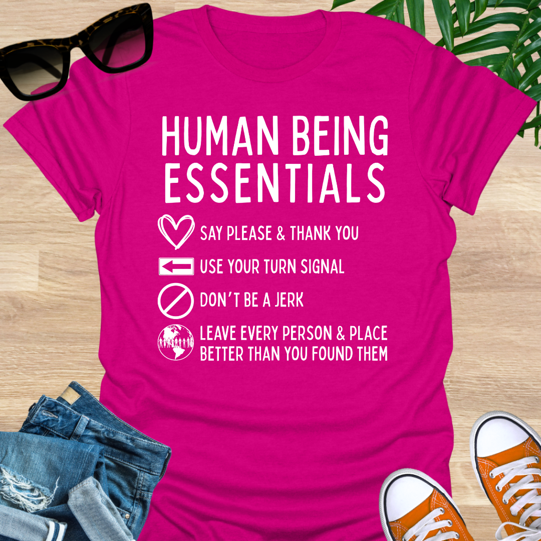 Funny “Human Being Essentials” checklist, please and thank you, turn signal, don’t be a jerk, leave it better, white icons on a hot pink unisex tee.