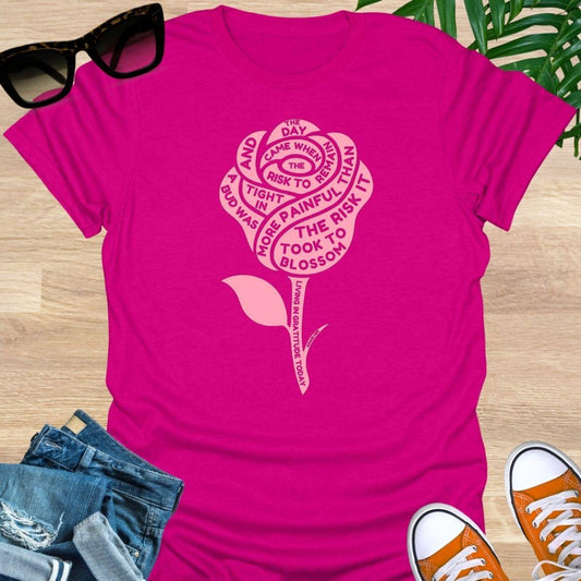 Pink rose with Anaïs Nin “Risk to Blossom” quote on empowerment and growth on hot pink unisex tee