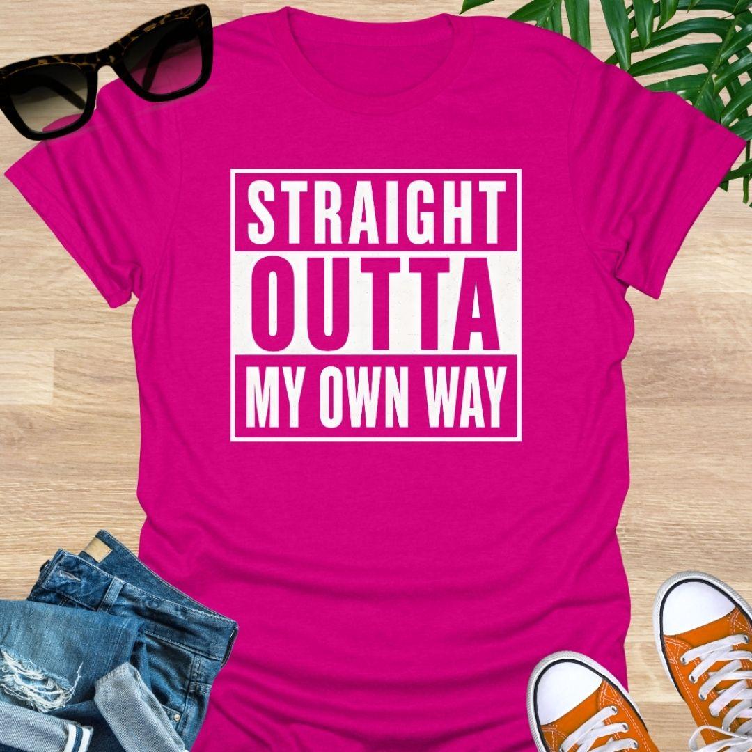 White block text reading “Straight Outta My Own Way” on a hot  pink unisex tee