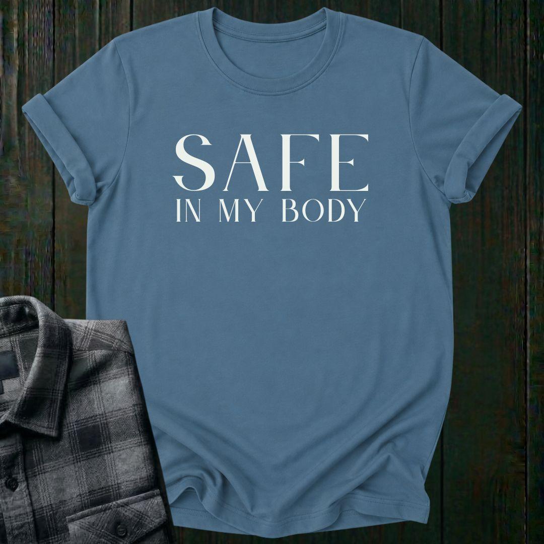 Minimalist typography design featuring the phrase "Safe in My Body" in elegant serif lettering on an indigo blue tee