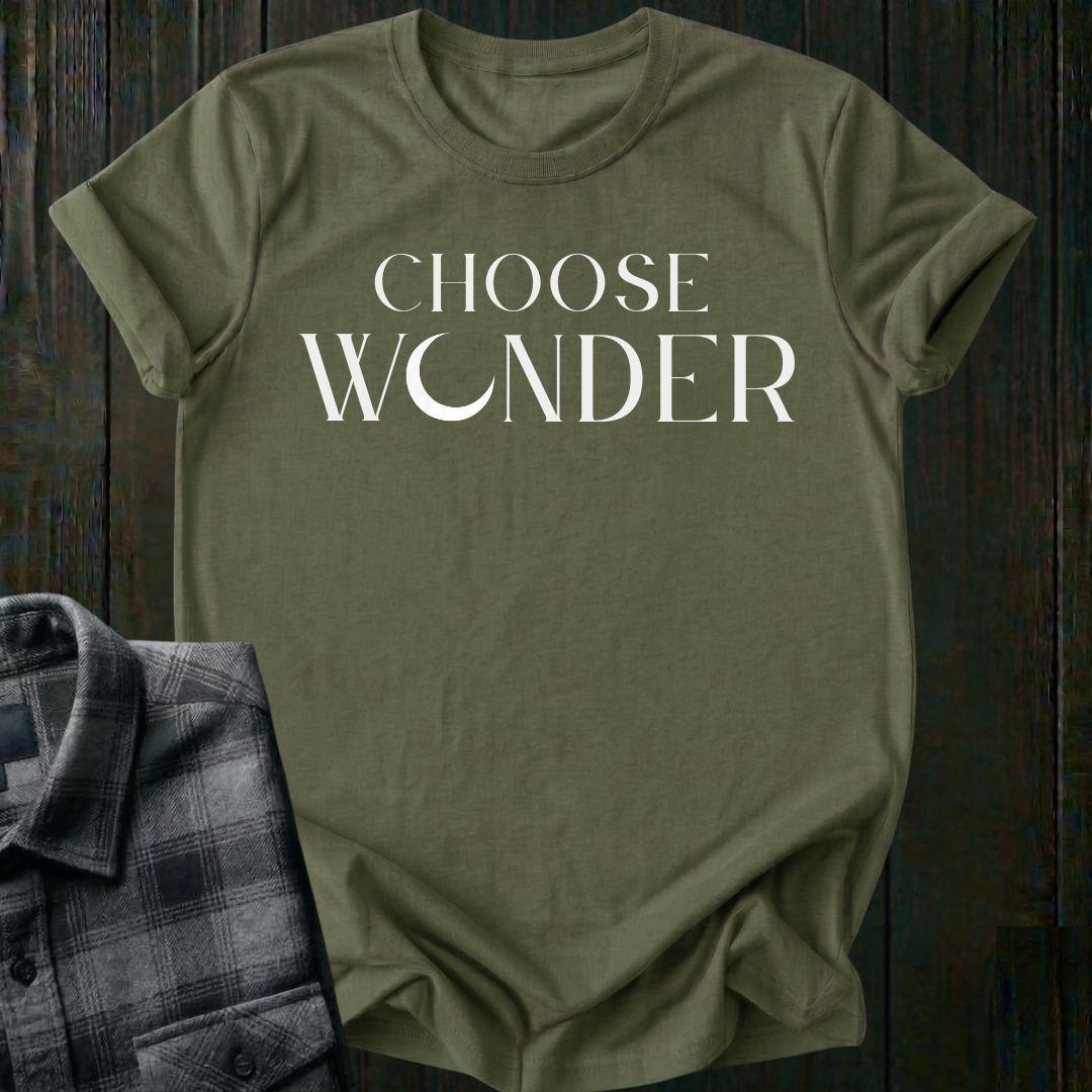 Minimalist typography design featuring the phrase "Choose Wonder" in elegant serif lettering on a military green tee
