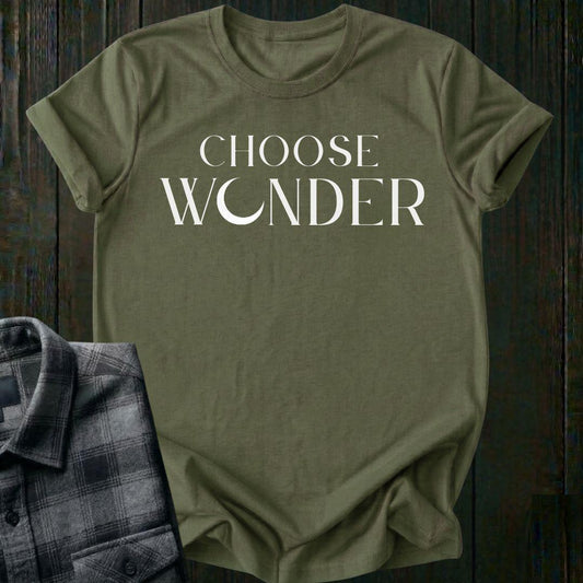 Minimalist typography design featuring the phrase "Choose Wonder" in elegant serif lettering on a military green tee