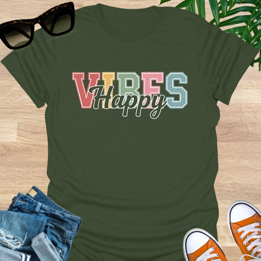“Happy Vibes” in retro varsity letters with script overlay on a military green unisex tee.