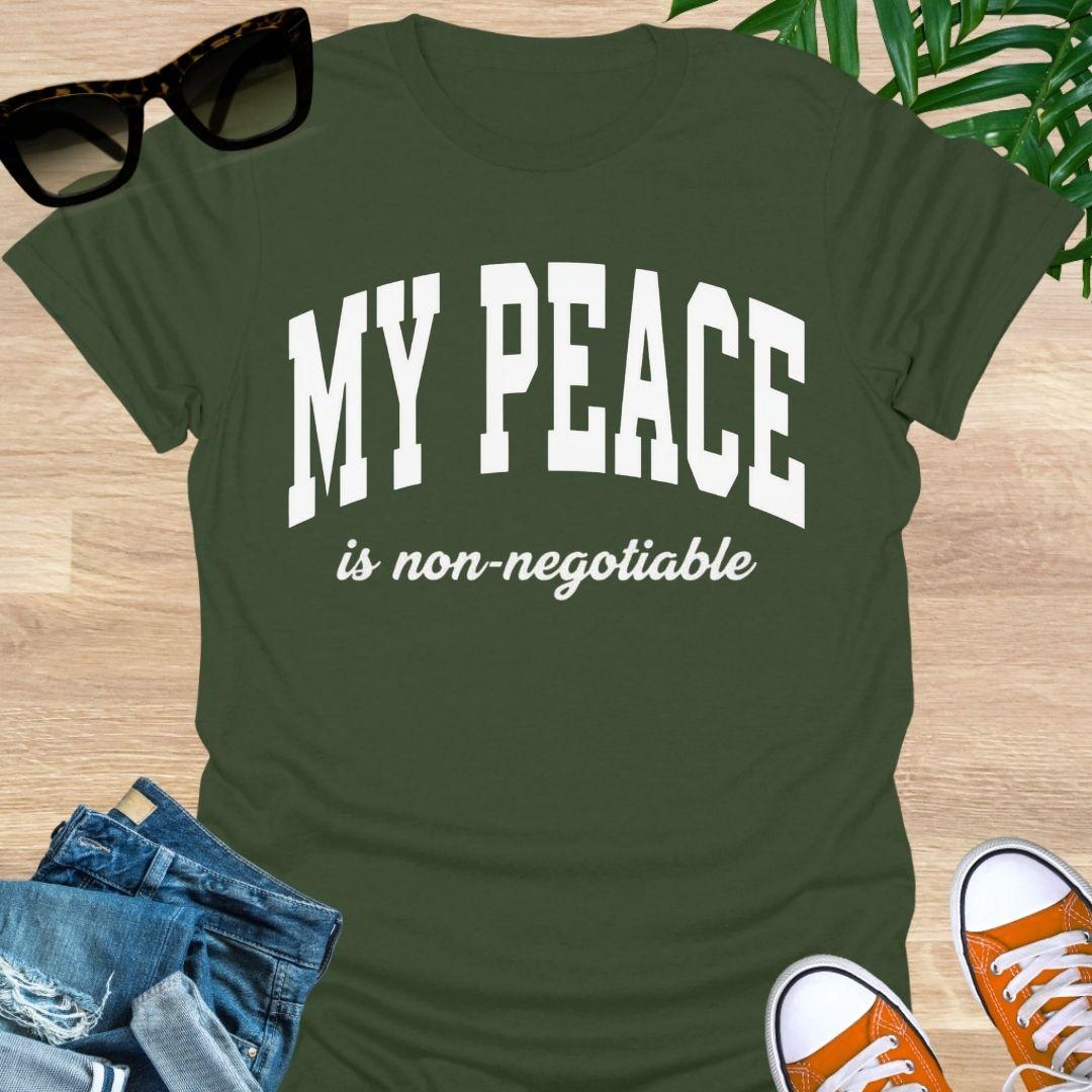 “My Peace Is Non-Negotiable” in white collegiate lettering on a military green unisex tee.