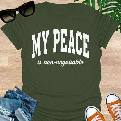“My Peace Is Non-Negotiable” in white collegiate lettering on a military green unisex tee.