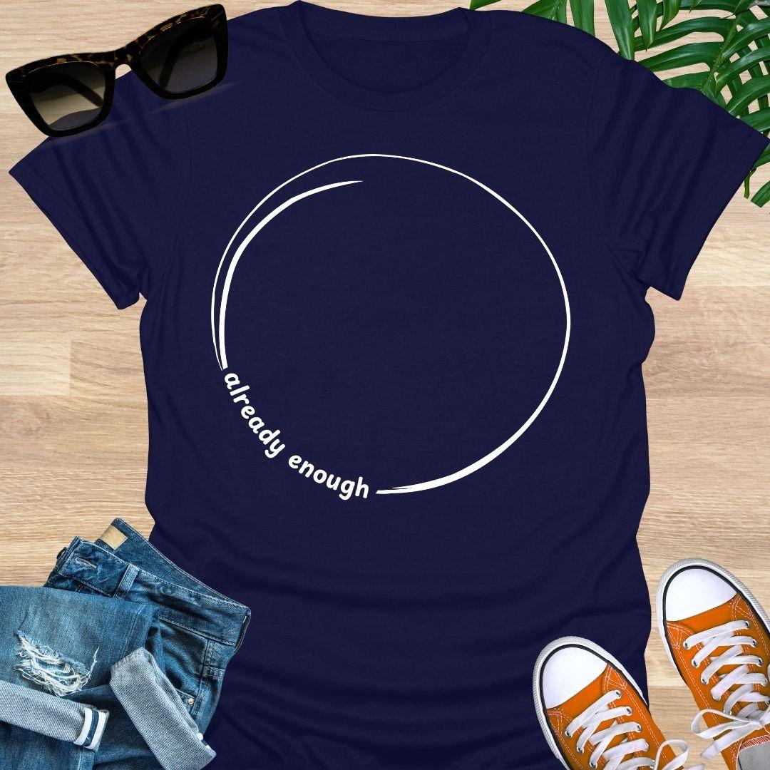 Minimal incomplete circle line art with the words “already enough” on a navy unisex t-shirt