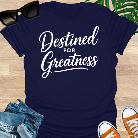 White script text reading “Destined for Greatness” on a navy motivational graphic tee.