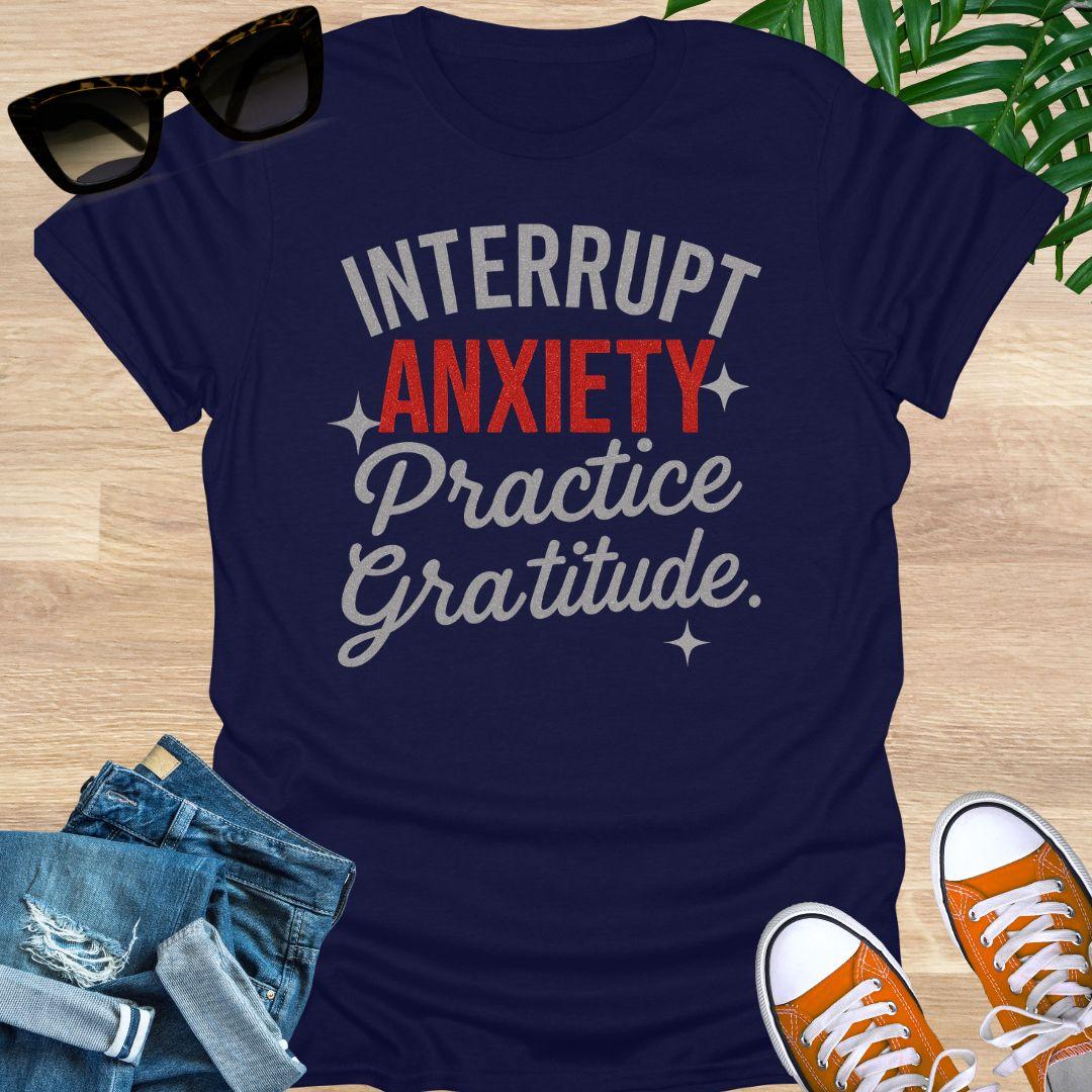 “Interrupt Anxiety, Practice Gratitude” sparkle text on a navy unisex mindfulness tee