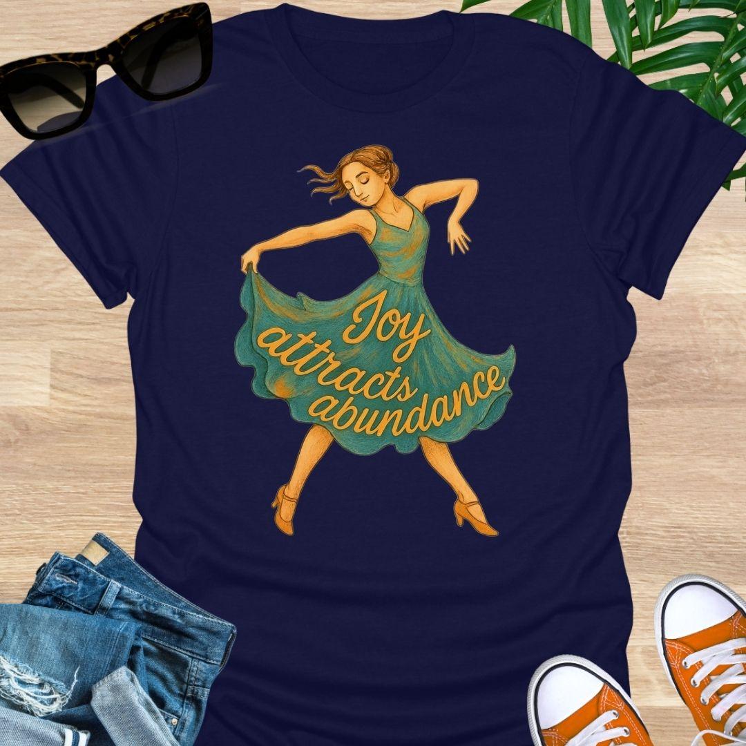 Joy attracts abundance dancer illustration on a navy unisex manifesting tee