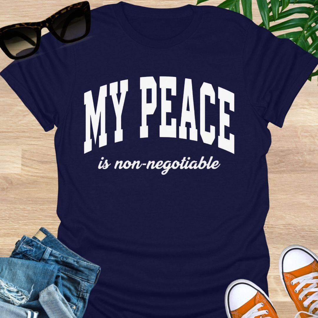 “My Peace Is Non-Negotiable” in white collegiate lettering on a navy unisex tee.