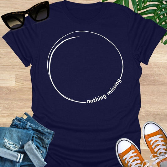 Minimal incomplete circle line art with the words “nothing missing” on a navy unisex t-shirt