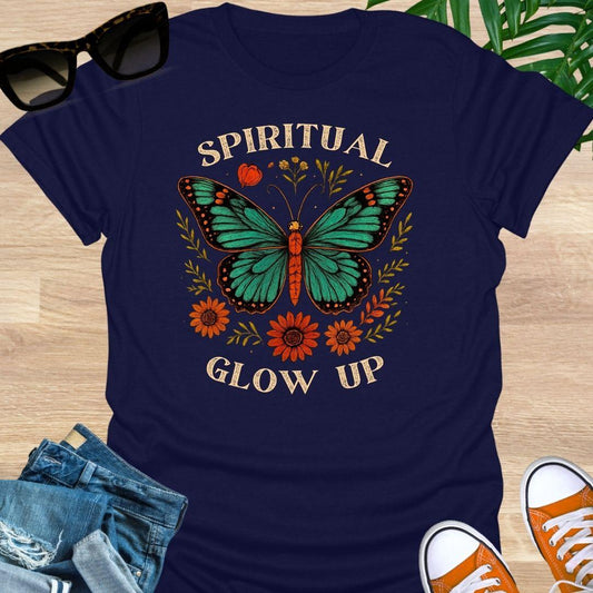 Spiritual Glow Up tee with vintage butterfly and floral accents on a navy unisex shirt