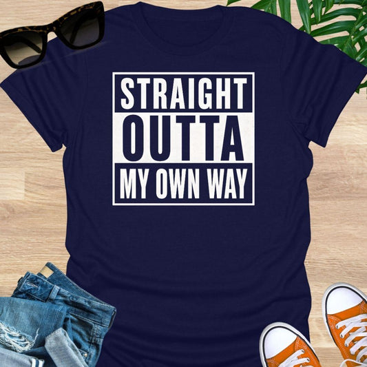 White block text reading “Straight Outta My Own Way” on a navy unisex tee.