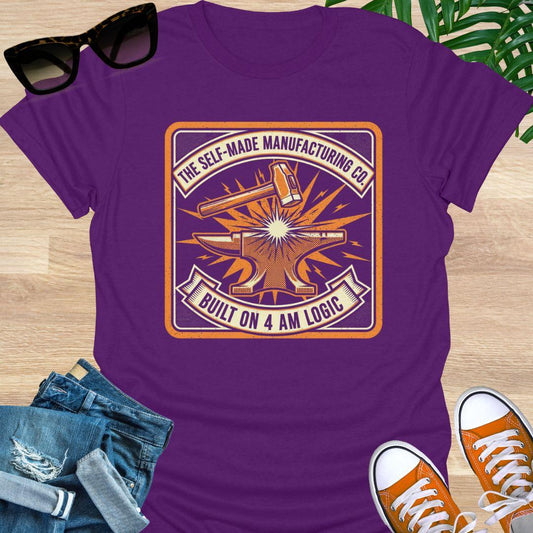 Vintage-style anvil and hammer graphic with the words “The Self-Made Manufacturing Co. – Built on 4 AM Logic” on a purple unisex t-shirt