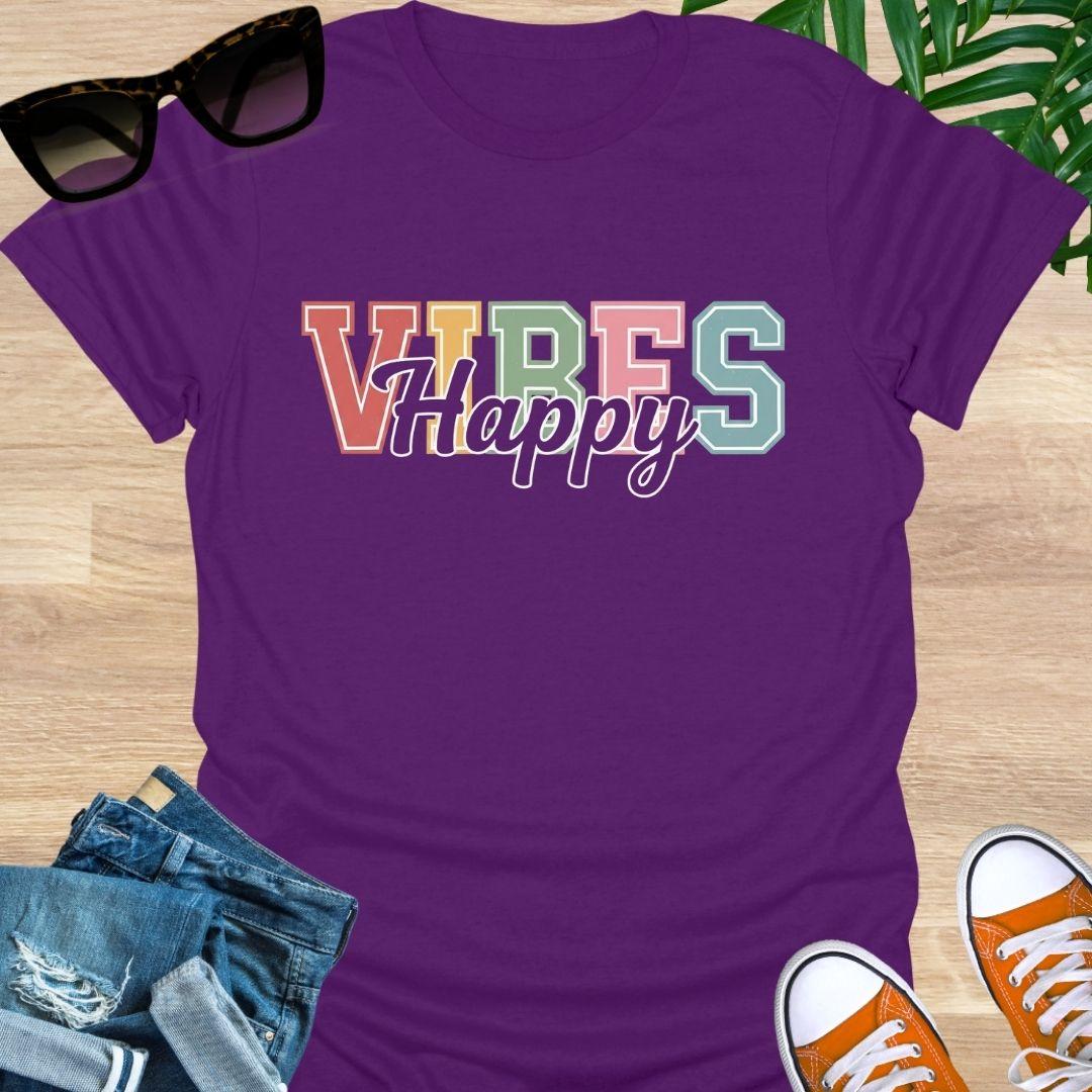 “Happy Vibes” in retro varsity letters with script overlay on a purple unisex tee.