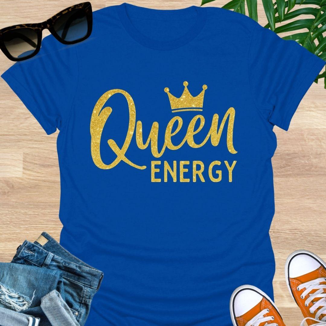 Gold glitter script “Queen Energy” with a crown on a blue empowerment graphic tee.