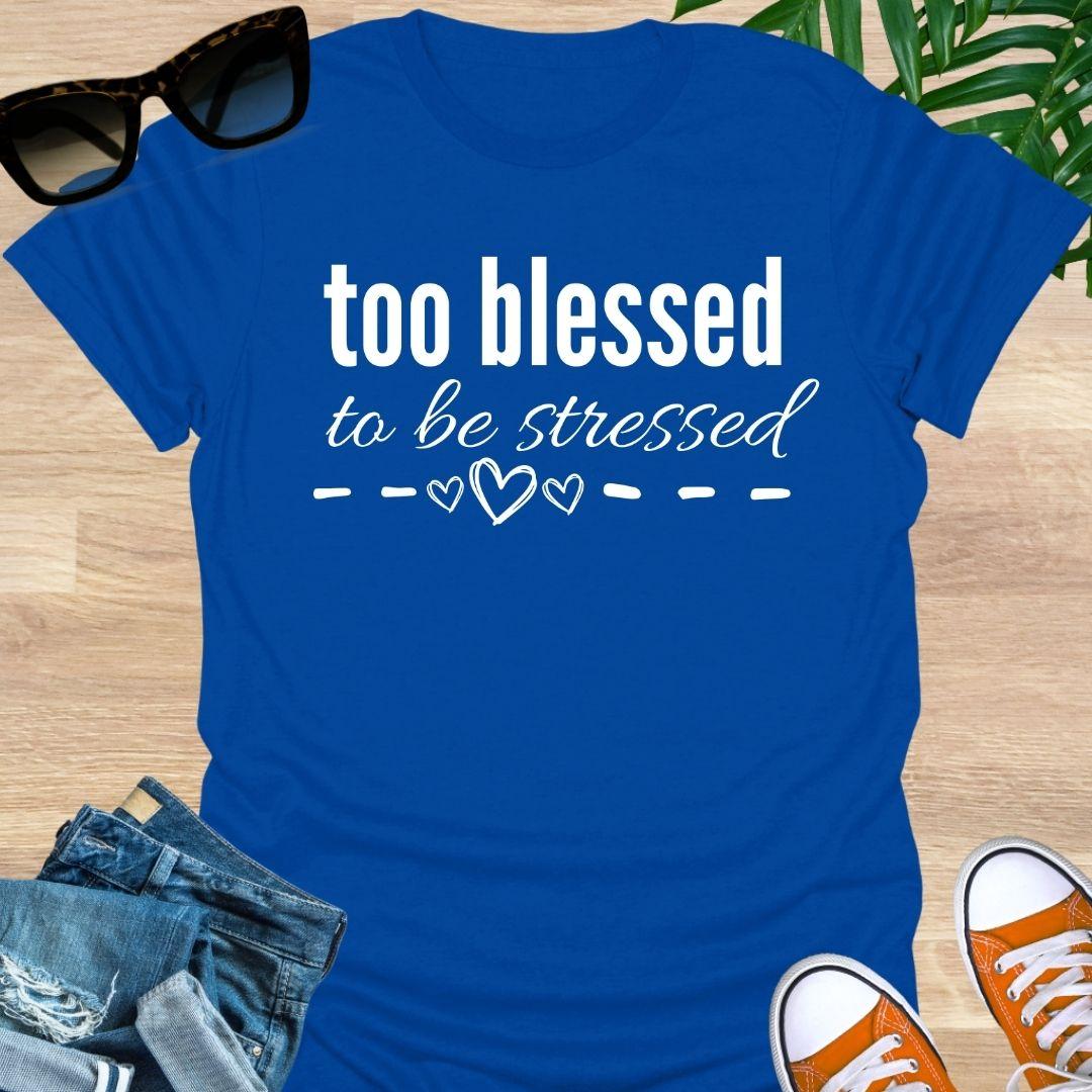 “Too Blessed to Be Stressed” text tee with hand-drawn hearts, white lettering on a blue unisex T-shirt.
