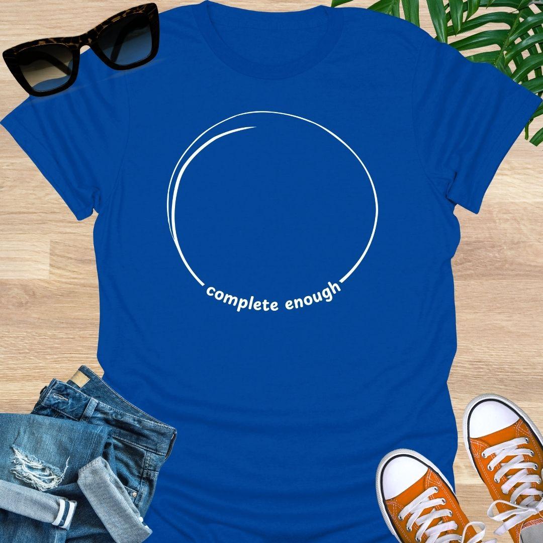 Minimal incomplete circle line art with the words “already enough” on a blue unisex t-shirt
