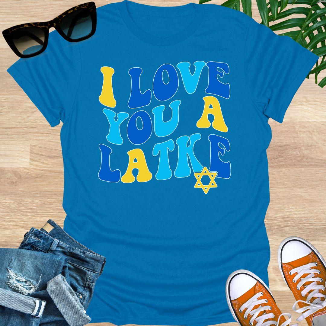 Retro blue and gold “I Love You a Latke” text with a small Star of David on a turquoise unisex Hanukkah tee.