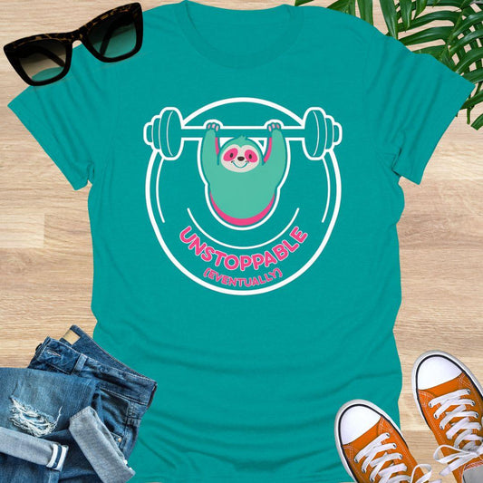 Cute sloth lifting barbell with Unstoppable (Eventually) message symbolizing persistence, patience, motivation, and steady progress on a jade dome unisex shirt