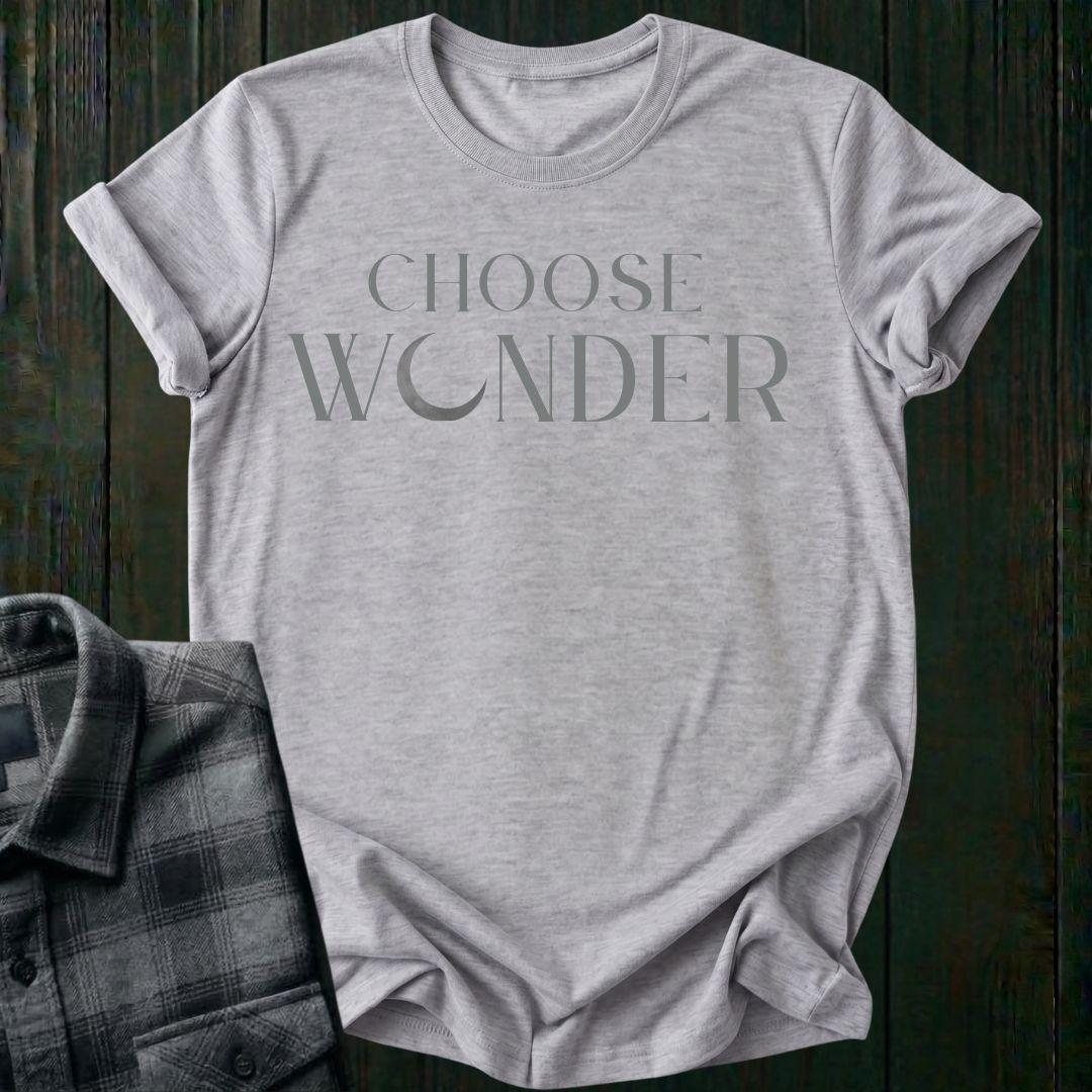 Minimalist typography design featuring the phrase "Choose Wonder" in elegant serif lettering on a sports gray tee